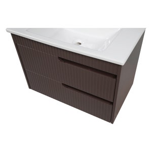 May include: A brown bathroom vanity with two drawers and a white ceramic sink.