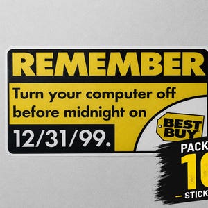 May include: A rectangular sticker with a yellow background and black text that reads REMEMBER Turn your computer off before midnight on 12/31/99. The sticker includes a Best Buy logo and a separate black graphic indicating a pack of 10 stickers.
