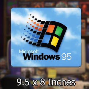 May include: A rectangular mouse pad measuring 9.5 by 8 inches featuring the Microsoft Windows 95 logo. The design displays the iconic multicolored window graphic against a light blue sky background with white clouds and the text Microsoft Windows 95.
