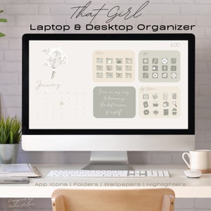 May include: A computer screen displaying a desktop organizer with a calendar, folders, and app icons. The screen is on a desk with a keyboard, a chair, and a mug. The text on the screen reads "That Girl Laptop & Desktop Organizer" and "January".