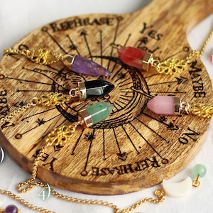 Piccolo pendolo per predire il futuro in pietra preziosa d'oro spirituale