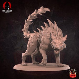 May include: A beige figurine of a fantasy beast, resembling a cat with spines and a segmented tail. The creature is depicted in an aggressive stance, mouth open, teeth visible. The base is circular. The figurine is highly detailed.
