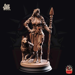 May include: A detailed brown figurine of a warrior woman with a wolf, holding a spear and an axe. The woman is wearing armor and a crown. The wolf stands beside her. The figurine is on a circular base with a black border.