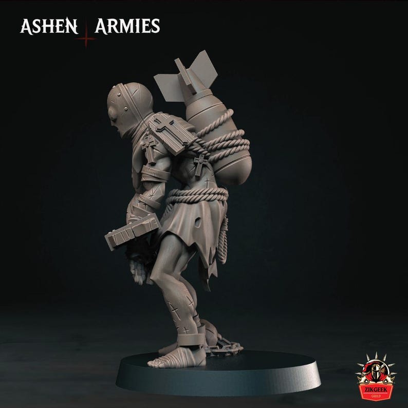 May include: A grey miniature figure from Ashen Armies featuring a helmeted character carrying a large bomb strapped to its back with rope. The figure wears tattered clothing, has cross symbols on its armor, and holds a rectangular object.