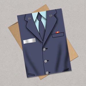 May include: A blue suit jacket with a light blue shirt and a dark blue tie. The jacket has a name tag, two buttons, and a pocket with a small red and yellow patch.