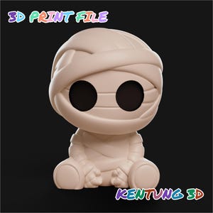 May include: A beige 3D print file figurine of a seated mummy character with large, circular, hollow black eyes and wrapped in bandages. The text 3D PRINT FILE appears at the top and KENTUNG 3D appears at the bottom in colorful letters.