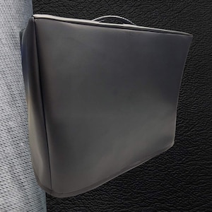 May include: Black leather amplifier cover with a carrying handle.
