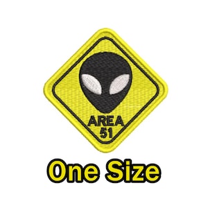May include: Yellow diamond-shaped warning sign with a black alien face and the text "AREA 51" inside. One Size.