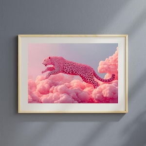 May include: A framed art print featuring a pink leopard leaping through pink clouds against a gradient sky. The leopard has a spotted pattern. The artwork is in a light wooden frame, suitable for wall decor.