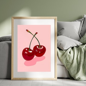 Puede incluir: Dos cerezas rojas con tallos verdes sobre un fondo rosa.