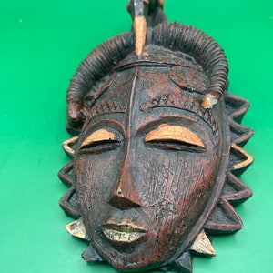 Handmade vintage native African wooden unique sculpture or mask