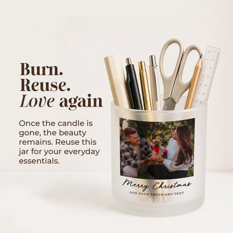 May include: A frosted glass jar filled with pens, a pencil, scissors, and a ruler. The jar features a custom photo of a couple with a dog and the text "Merry Christmas" and "ADD YOUR PHOTO AND TEXT". Text on the left reads "Burn. Reuse. Love again".