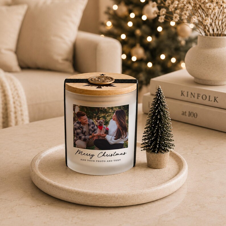 May include: A frosted glass candle jar with a wooden lid and a black band featuring a gold wax seal. The front displays a custom photograph of a couple with a dog, with the printed text Merry Christmas and ADD YOUR PHOTO AND TEXT below it.