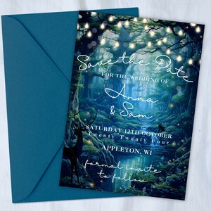 May include: Save the Date wedding invitation with a blue and green forest background, glowing lights, and the text "Save the Date for the wedding of Anna & Sam Saturday 12th October Twenty Twenty Four Appleton, WI formal invite to follow"