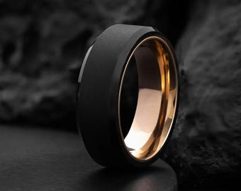 タナトス：大胆なブラックタングステンとローズゴールド、カスタムエンゲージリング、モダンなメンズ結婚指輪、耐久性のあるミニマリストリング