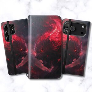 May include: Three black phone cases featuring a graphic print of a snarling wolf surrounded by red flames and glowing red eyes. Each case has a textured surface and a vertical black elastic strap across the front to keep the cover closed securely.