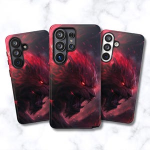 May include: Three rectangular smartphone cases featuring a dark, fiery graphic of a snarling wolf with glowing red eyes and fur. The design incorporates deep red and black tones, with the wolf's face prominently displayed on the back of each case.
