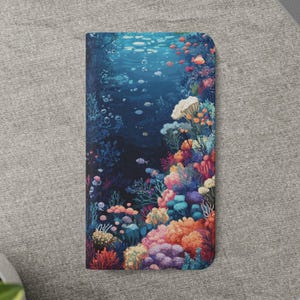 May include: A rectangular journal cover featuring a vibrant underwater scene. The design showcases colorful coral reefs, fish, and bubbles against a deep blue background. The cover is a vertical rectangle.