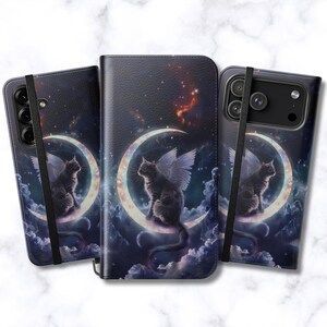 May include: Phone cases with a celestial design featuring a winged cat perched on a crescent moon. The cases have a dark blue background with stars and clouds. The cat is gray with white wings. The cases are shown in different angles.