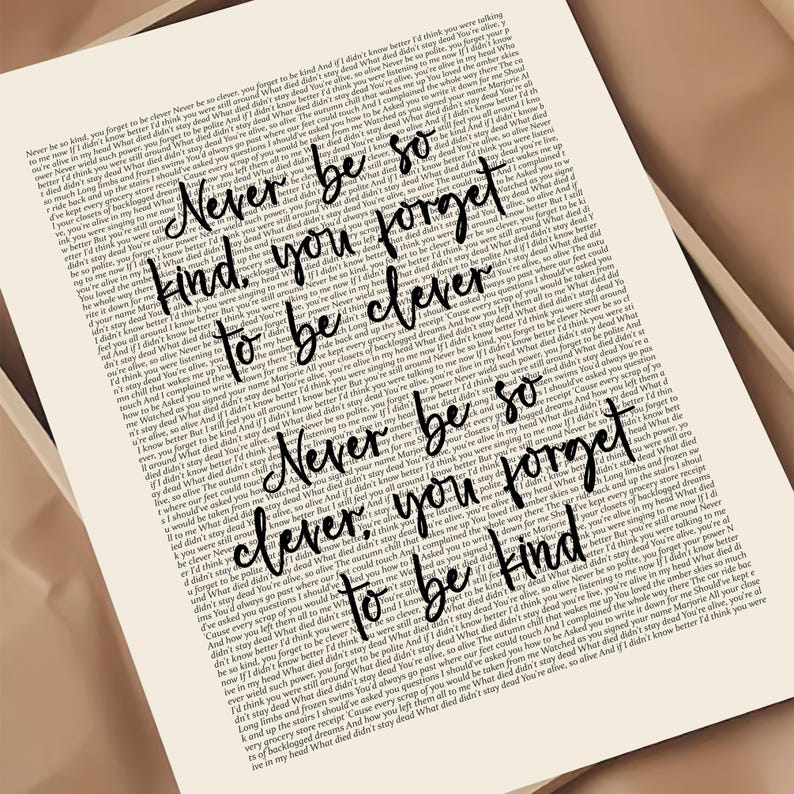 May include: A cream-coloured print featuring the words "Never be so kind, you forget to be clever. Never be so clever, you forget to be kind." The text is in black, handwritten-style lettering.