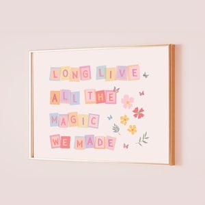 May include: A framed art print with the words "LONG LIVE ALL THE MAGIC WE MADE" in colorful block letters. The print features butterflies and floral accents in pink, yellow, and red.