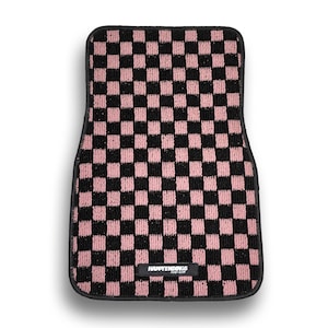 May include: Pink and black checkered car floor mat with the text "HAPPYENDINGS" in black.