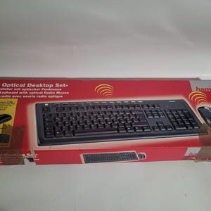 May include: A red box containing a black keyboard and mouse set. The box is labelled "RF Optical Desktop Set" and features the brand "hama." The keyboard and mouse are wireless and optical.
