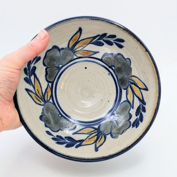 Vintage signed studio pottery bowl hand painted with blue and yellow leaves and flowers