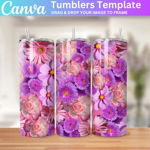 May include: Three stainless steel tumblers with a floral design. The tumblers are pink with purple flowers and have a straw.