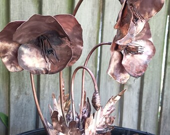 3 flower and a single bud Poppy copper water feature