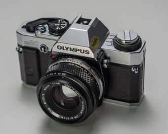 Olympus OM20 SLR Film Camera with Olympus Zuiko 50mm f1.8 Lens and Leather Case - Fully working and Tested - MINT Condition A+++