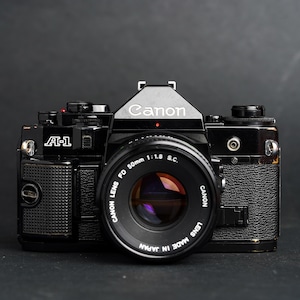 Canon A-1 SLR Film Camera with Canon FD 50mm F1.8 Spectra Coated Lens - Fully Working/Tested - New Light Seals/READ