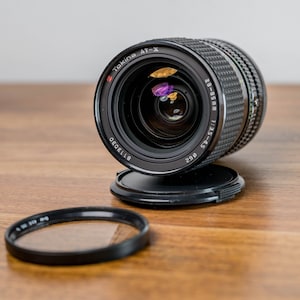Tokina AT-X 28-85mm f3.5-4.5 Zoom Lens for Canon FD Mount for Canon A-1/AE-1/Av1/F-1 in Mint Condition, Fully Working