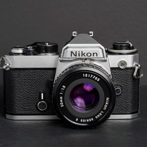 Nikon FE SLR Film Camera with Nikon 50mm f1.8 E Series Lens - Fully Working - New Light Seals