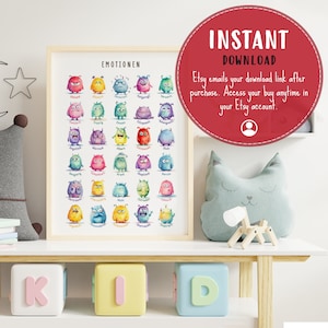 May include: A printable poster featuring colourful cartoon monsters representing different emotions. The poster is titled "Emotionen" and features German words for each emotion. The poster is framed and displayed on a shelf with other items.