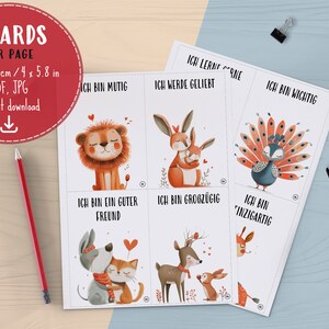 May include: Four printable cards featuring watercolor illustrations of animals with positive affirmations in German. The animals include a lion, a rabbit, a peacock, a dog, a deer, and a cat. The text on the cards reads: "Ich bin mutig", "Ich bin ein guter Freund", "Ich bin groz&uuml;gig", "Ich bin einzigartig", "Ich lerne gerne", "Ich werde geliebt", and "Ich bin wichtig".