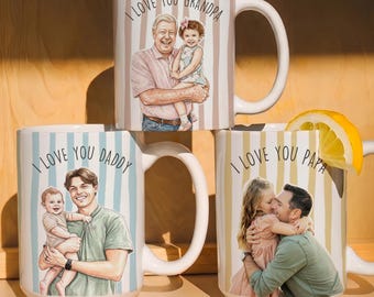 May include: Three white ceramic mugs with vertical striped patterns and the phrases "I Love You Grandpa", "I Love You Daddy", and "I Love You Papa". Each mug features a portrait of a person holding a child. A lemon slice rests on one mug.