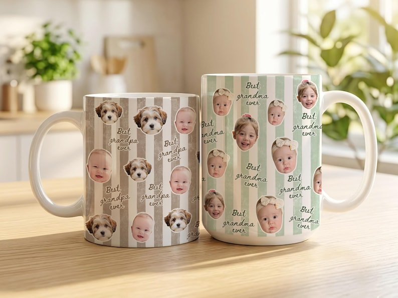 May include: Two white ceramic mugs. One mug features a brown and white striped pattern with baby faces and dog faces, and the text "Best grandpa ever." The other mug has a green and white striped pattern with baby faces and the text "Best grandma ever."
