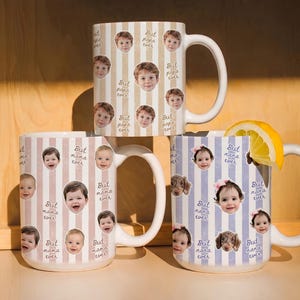 May include: Three white ceramic mugs with large handles. Each mug features a vertical striped pattern and is decorated with photos of children and the phrases "Best papa ever", "Best mama ever", and "Best nana ever". One mug has a lemon slice.