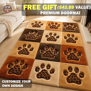 May include: A rectangular doormat featuring a grid of twelve squares, each containing a recessed paw print design. The paw prints display a brown and black leopard print pattern, while the surrounding square borders are in shades of tan and brown.