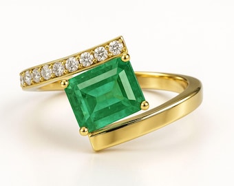 Anillo de oro macizo de 14 k con esmeralda y diamantes de talla esmeralda
