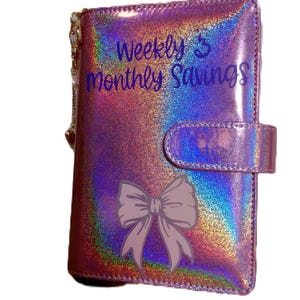 Carpeta de ahorros semanal y mensual, categorías personalizables, transferencia bancaria, hojas de papel de protección.