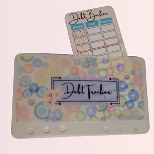 Tarjeta de seguimiento para eliminar deudas con sobre de vitela a juego para adaptarse a una carpeta de tamaño A6 para rellenar con efectivo.