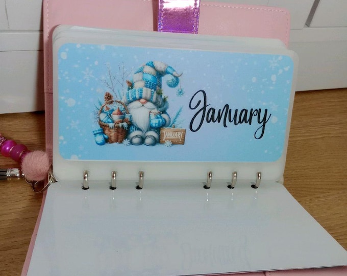 Gonks themed annual savings binder including 12 months of the year vellums and trackers saving 120 per month.