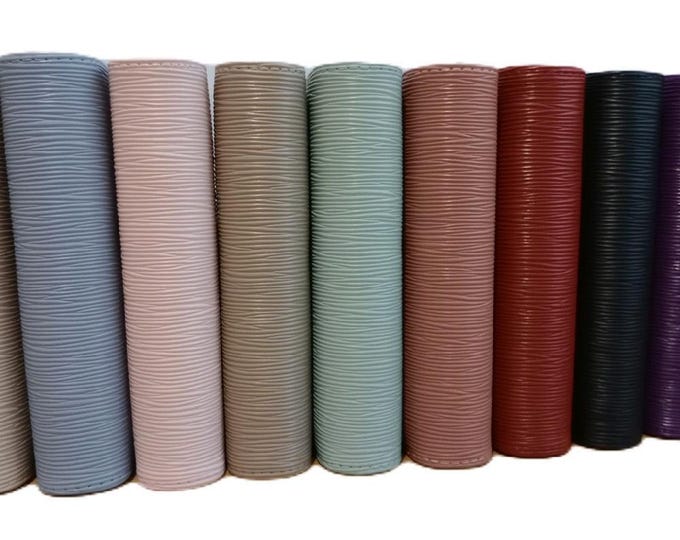 Stunning luxury saffino ribbed a6 binders in 9 colour choices. beautiful texture and high quality gold ring binder fittings.