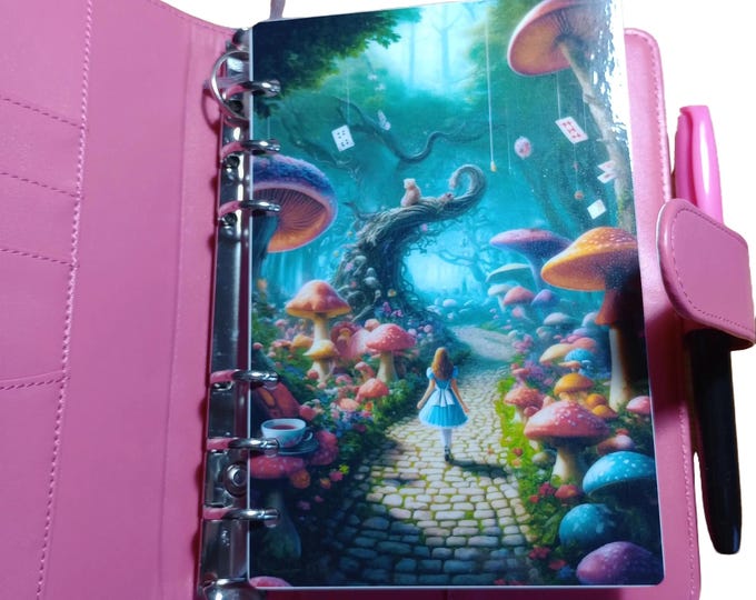 Wonderland binder set with cover and dashboard and matching twin pocket vellum envelopes. includes five trackers and dice.