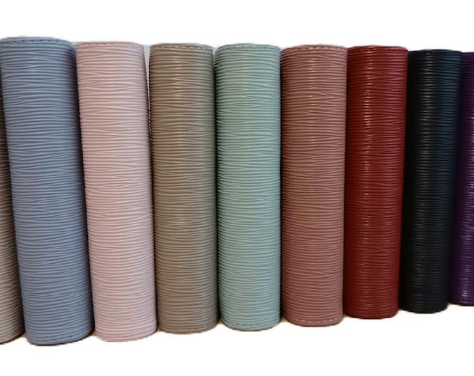 Stunning luxury saffino ribbed a6 binders in 9 colour choices. beautiful texture and high quality gold ring binder fittings.