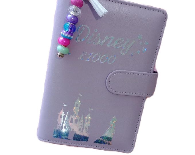 D*sney 1000 savings binder - princesses. 10 dashboard trackers and vellums. save 100 per tracker and 1000 overall.
