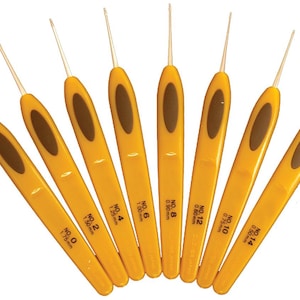 May include: A set of eight crochet hooks with yellow handles and brown oval grips. Each hook is labeled with a number and millimeter size, ranging from No. 0 (1.75mm) to No. 14 (0.50mm).