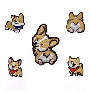 May include: A collection of five embroidered patches featuring corgi dog designs. The patches showcase various poses, including a corgi wearing a blue bow tie, a corgi's rear, and corgis with red bandanas. The patches are in shades of brown, white, and black.
